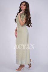 Light green draped dress with rose brooch 