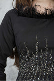 Soft evening dress decorated with shiny beads