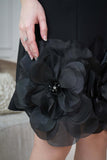 Classic short dress with prominent flowers in black 