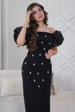 Classic long dress with a slim cut and decorated with crystals in black 