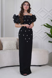 Classic long dress with a slim cut and decorated with crystals in black 