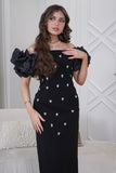 Classic long dress with a slim cut and decorated with crystals in black 