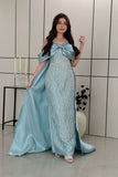 Long evening dress decorated with fringe in Tiffany color 