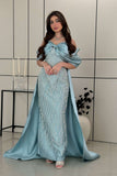 Long evening dress decorated with fringe in Tiffany color 