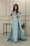 Long evening dress decorated with fringe in Tiffany color 