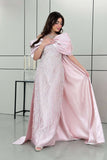 Long evening dress decorated with pink fringe 