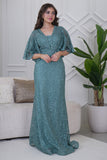 Long evening dress embroidered with stones in light green 