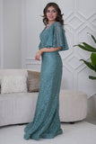 Long evening dress embroidered with stones in light green 