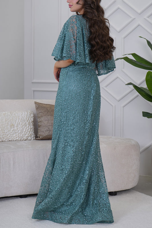 Long evening dress embroidered with stones in light green 