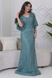 Long evening dress embroidered with stones in light green 