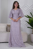 Long embroidered evening dress decorated with rhinestones in pink color 