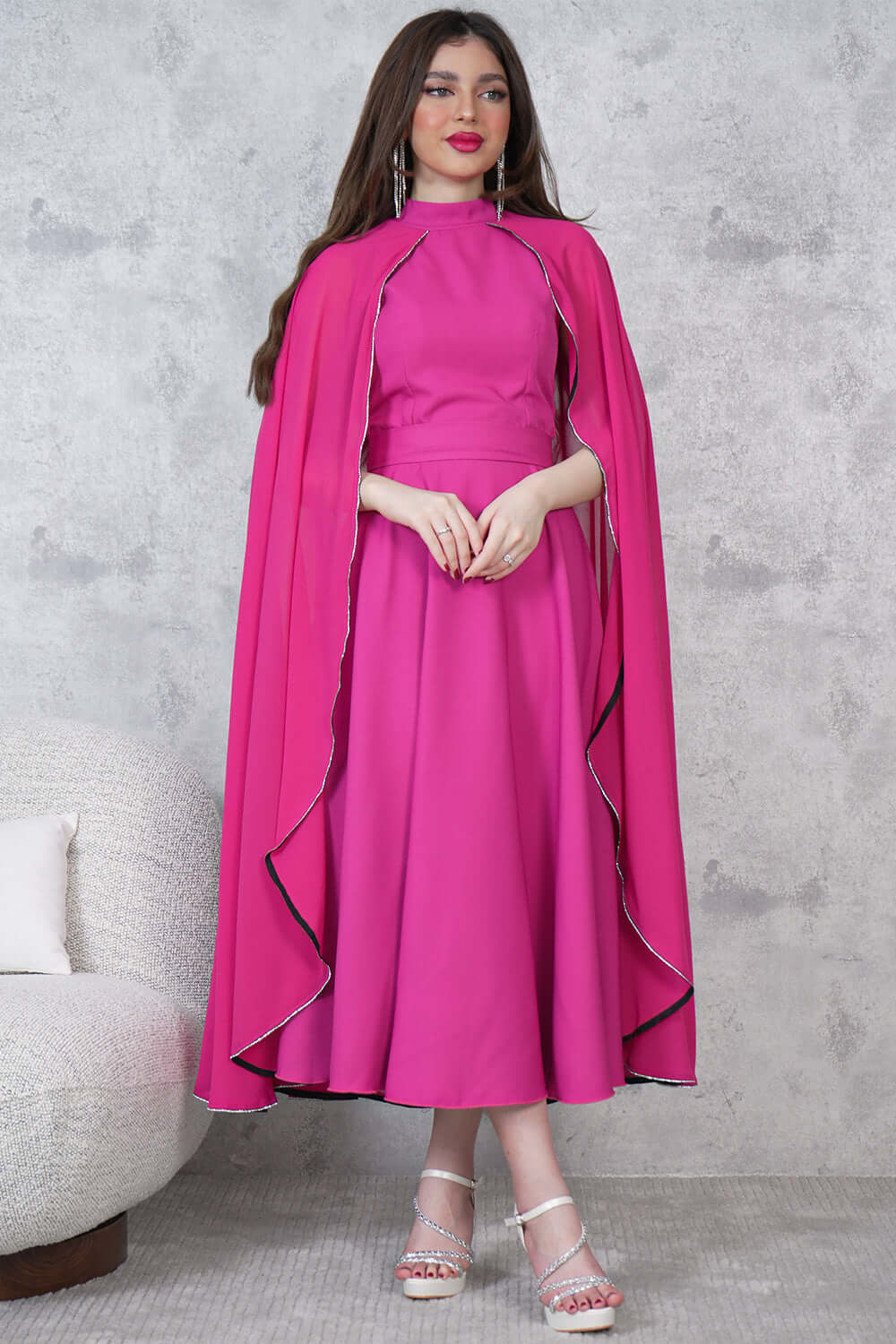 Elegant midi dress with a cape design and embellished with beads 