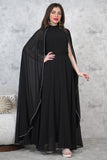 Elegant dress with a cape design decorated with beads 