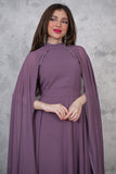 Elegant dress with a cape design decorated with beads 