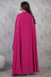 Elegant dress with a cape design decorated with beads 