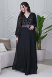 Black evening dress with embroidered piece and studs 