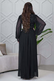 Black evening dress with embroidered piece and studs 