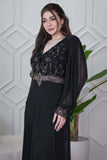 Black evening dress with embroidered piece and studs 