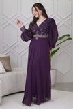 Evening dress decorated with an embroidered piece and purple stones 