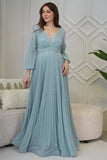 Long pleated evening dress decorated with tiffany blue stones 