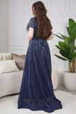 Long evening dress decorated with rhinestones and feathers in navy blue 