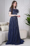 Long evening dress decorated with rhinestones and feathers in navy blue 