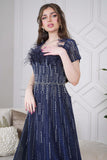 Long evening dress decorated with rhinestones and feathers in navy blue 