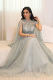 Tulle evening dress embroidered with a cape design 