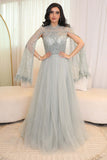 Tulle evening dress embroidered with a cape design 