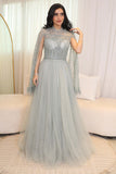 Tulle evening dress embroidered with a cape design 