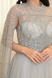 Tulle evening dress embroidered with a cape design 