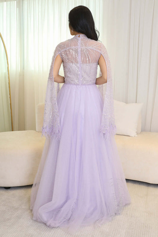 Tulle evening dress embroidered with a cape design 