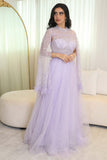 Tulle evening dress embroidered with a cape design 