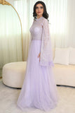 Tulle evening dress embroidered with a cape design 