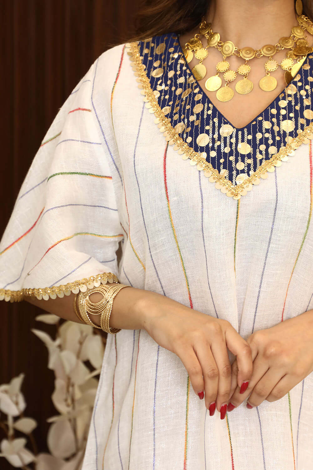 Midi striped jalabiya decorated with gold details 