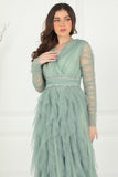 Evening dress with layers of ruffles and embroidered waist in pistachio color