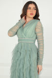 Evening dress with layers of ruffles and embroidered waist in pistachio color