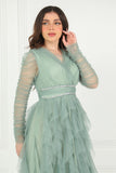 Evening dress with layers of ruffles and embroidered waist in pistachio color