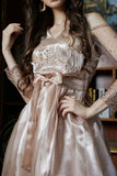 Fluffy evening dress decorated with beige pebbles