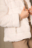 White winter jacket with hoodie collar and zipper