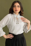 Polka dot blouse with tie