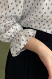 Polka dot blouse with tie