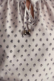 Polka dot blouse with tie