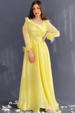 Elegant yellow evening dress decorated with crystals 