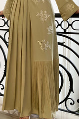 Split dress embroidered with sequins and decorated with a light green fringe