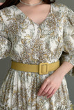 فستان كلوش بطباعة ازهار مزين بكريستال لون اصفر