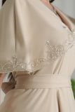 Evening dress with embroidered sleeves and edges