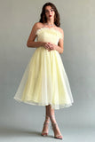 Yellow feather-decorated cloche top dress