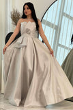 Gray evening dress with a bow