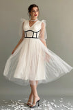 White tulle dress with crochet cut